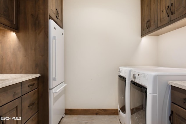 1288 E Haystacker Dr, Eagle, CO 81631 - washroom featuring cabinets and washing machine and clothes dryer