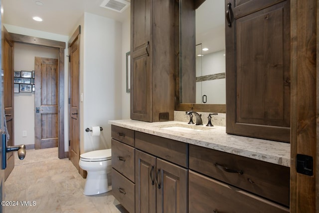 1288 E Haystacker Dr, Eagle, CO 81631 - bathroom with vanity, toilet, and a shower with shower door