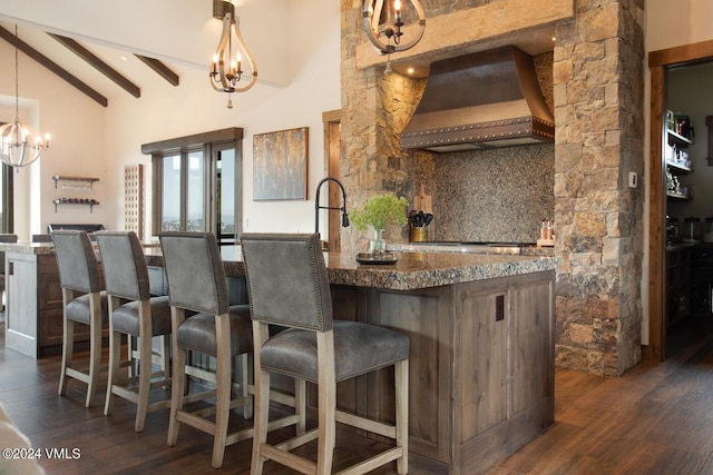 1288 E Haystacker Dr, Eagle, CO 81631 - kitchen with premium range hood, dark hardwood / wood-style flooring, an inviting chandelier, and decorative light fixtures