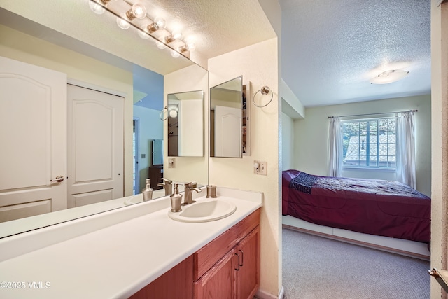 705 Crazy Horse Cir, Edwards, CO 81632 - bathroom featuring ensuite bathroom, a textured ceiling, and vanity
