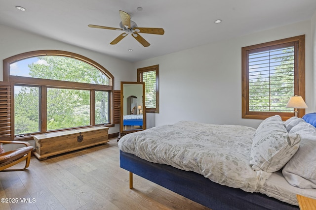 225 Alcazar Dr, Edwards, CO 81632 - bedroom with multiple windows, wood finished floors, recessed lighting, and a ceiling fan