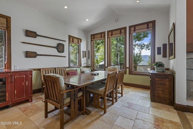 225 Alcazar Dr, Edwards, CO 81632 - dining area with stone tile floors, lofted ceiling, and recessed lighting
