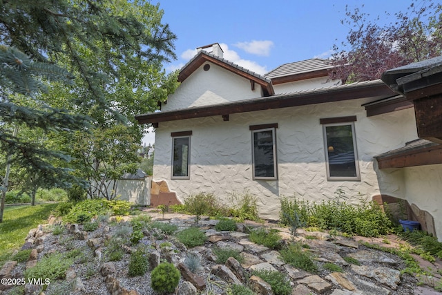 225 Alcazar Dr, Edwards, CO 81632 - view of front of home with stucco siding and a chimney