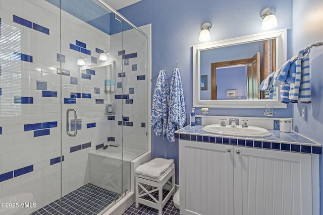 225 Alcazar Dr, Edwards, CO 81632 - full bath featuring vanity and a shower stall