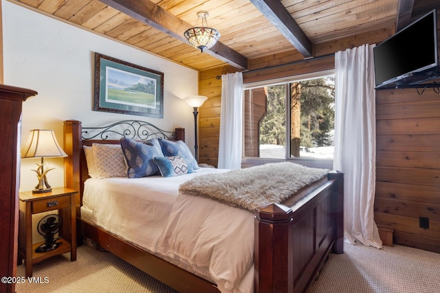 bedroom featuring wood ceiling, carpet floors, and beam ceiling