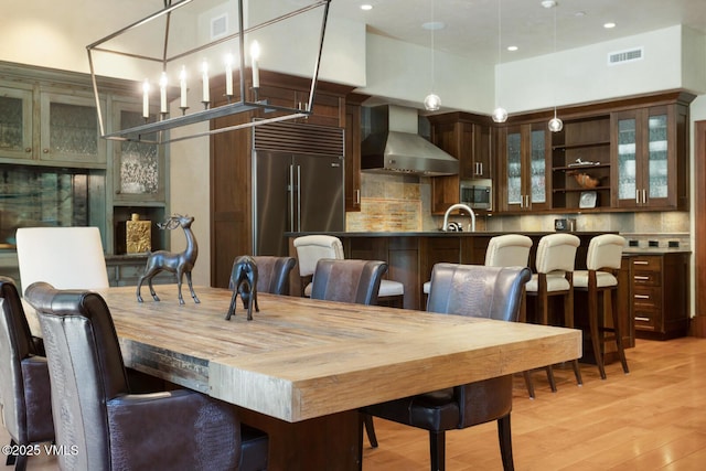 153 Village Walk, Beaver Creek, CO 81620 - dining space featuring light wood finished floors and recessed lighting