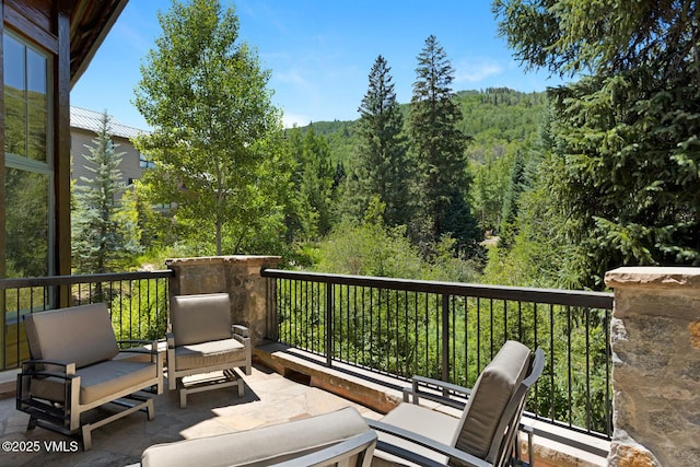 153 Village Walk, Beaver Creek, CO 81620 - wooden deck featuring a forest view and outdoor lounge area