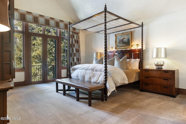 carpeted bedroom with multiple windows, access to outside, and high vaulted ceiling