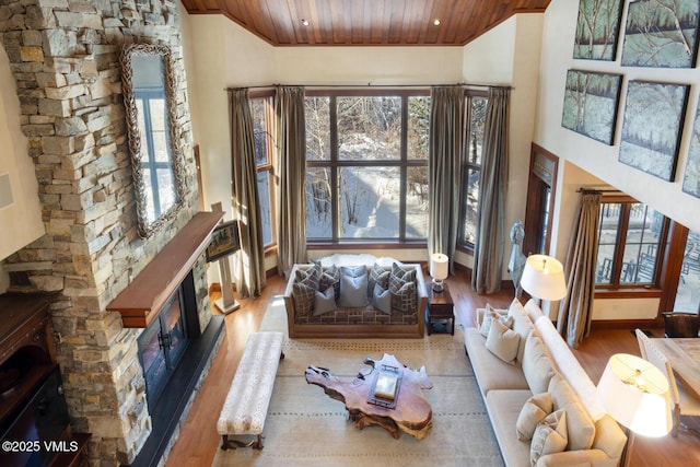 interior space featuring wood ceiling, high vaulted ceiling, and hardwood / wood-style flooring