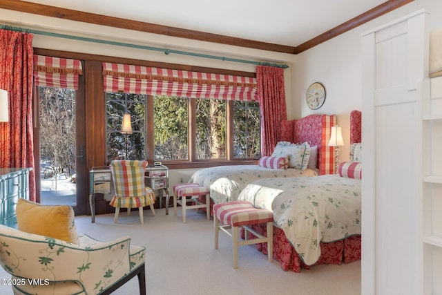 carpeted bedroom featuring ornamental molding and access to outside