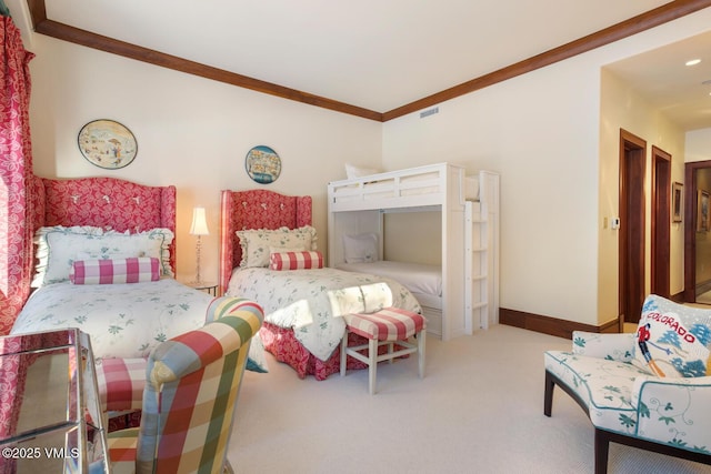 bedroom featuring crown molding and carpet flooring