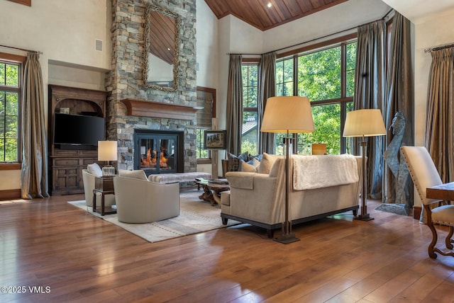 153 Village Walk, Beaver Creek, CO 81620 - living room with high vaulted ceiling, hardwood / wood-style flooring, a fireplace, and wood ceiling