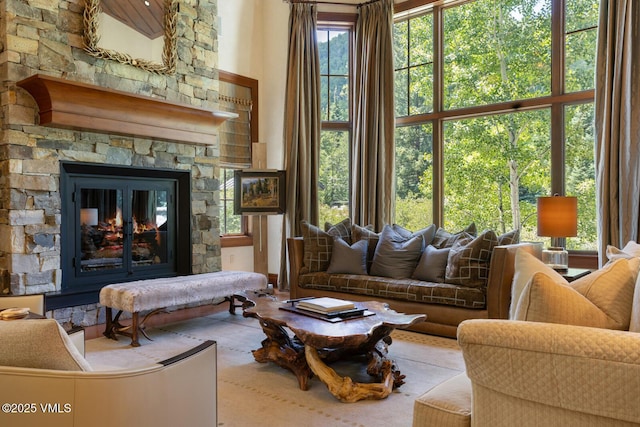 153 Village Walk, Beaver Creek, CO 81620 - living area with a fireplace and a high ceiling