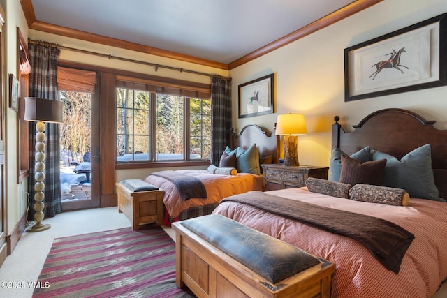 bedroom featuring access to exterior and light colored carpet