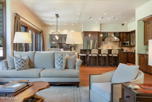 153 Village Walk, Beaver Creek, CO 81620 - living room featuring light wood-style floors and recessed lighting