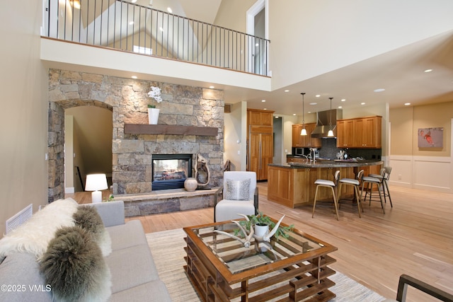 88 E Double Hitch, Eagle, CO 81631 - living room with a towering ceiling, a fireplace, light wood-style floors, and recessed lighting