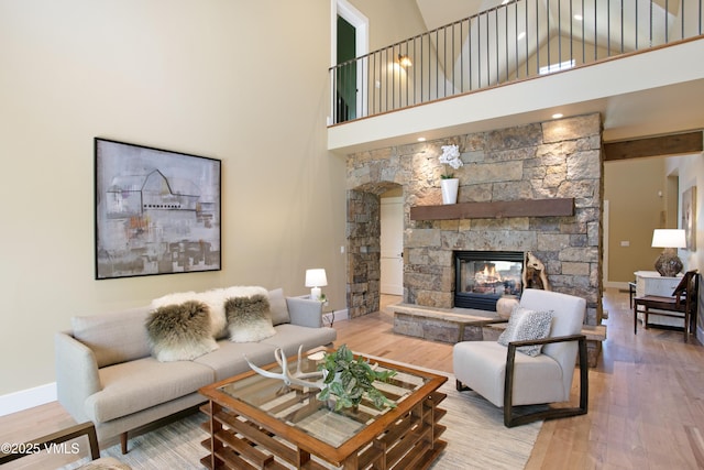 88 E Double Hitch, Eagle, CO 81631 - living area featuring a towering ceiling, a fireplace, and wood finished floors