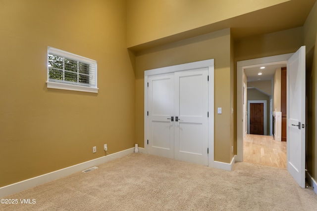 88 E Double Hitch, Eagle, CO 81631 - unfurnished bedroom with carpet, a closet, and a towering ceiling