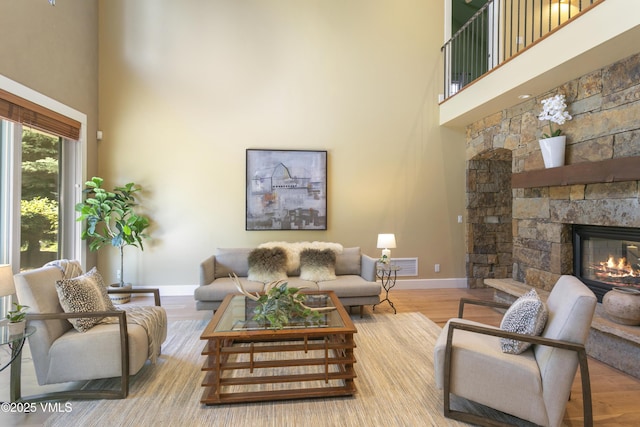 88 E Double Hitch, Eagle, CO 81631 - living area featuring a high ceiling, a fireplace, and wood finished floors