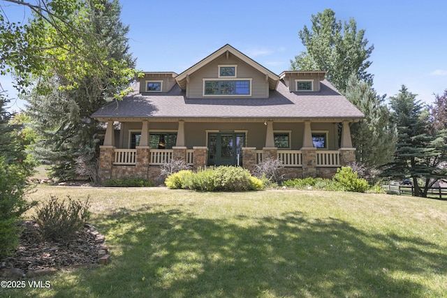 88 E Double Hitch, Eagle, CO 81631 - craftsman-style home with covered porch, stone siding, a front yard, and a shingled roof