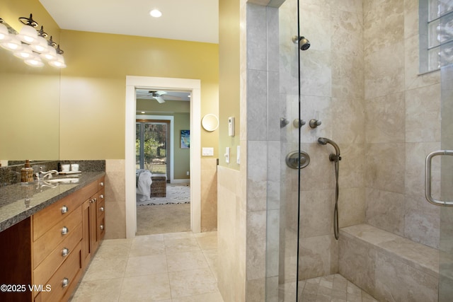 88 E Double Hitch, Eagle, CO 81631 - ensuite bathroom with a stall shower, vanity, tile patterned floors, wainscoting, and a ceiling fan