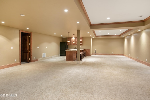 88 E Double Hitch, Eagle, CO 81631 - unfurnished living room featuring recessed lighting, bar area, ornamental molding, light colored carpet, and a raised ceiling