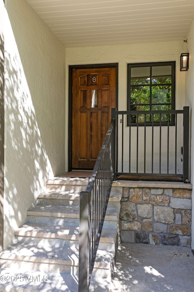 355 Offerson Rd Unit P4, Beaver Creek, CO 81620 - view of exterior entry with stucco siding and covered porch