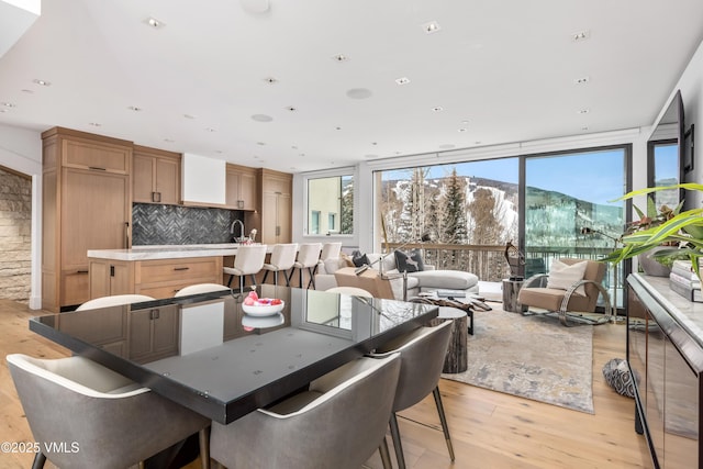 784 Potato Patch Dr Unit W, Vail, CO 81657 - dining space featuring light wood finished floors, floor to ceiling windows, and recessed lighting
