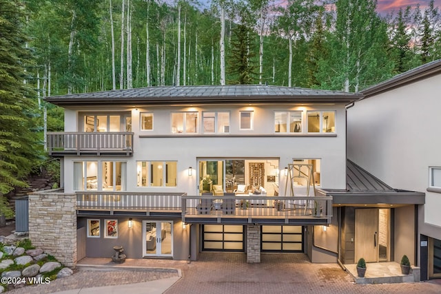 784 Potato Patch Dr Unit W, Vail, CO 81657 - view of front of home with a standing seam roof, a balcony, and stucco siding