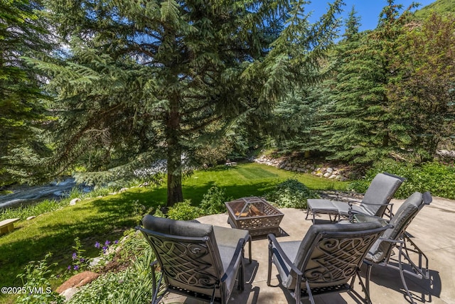 2764 S Frontage Rd, Vail, CO 81657 - view of patio / terrace with an outdoor fire pit
