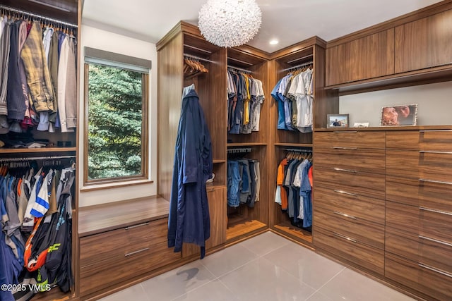 2764 S Frontage Rd, Vail, CO 81657 - spacious closet featuring tile patterned flooring and a chandelier