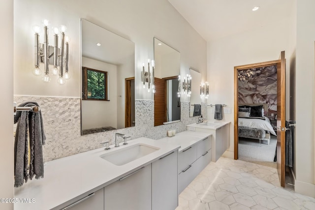 2764 S Frontage Rd, Vail, CO 81657 - bathroom featuring double vanity, ensuite bath, recessed lighting, and decorative backsplash