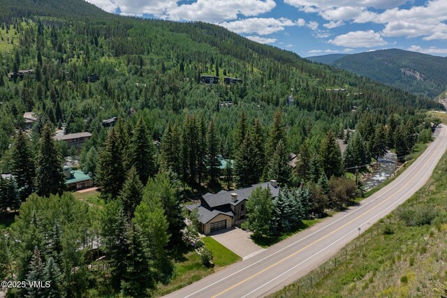 2764 S Frontage Rd, Vail, CO 81657 - aerial view of property and surrounding area featuring a forest and a mountainous background