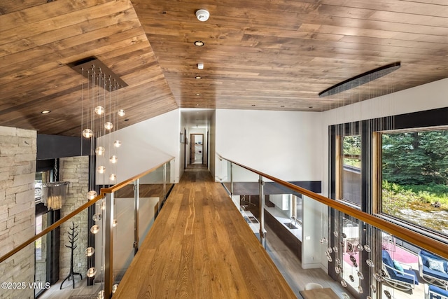 2764 S Frontage Rd, Vail, CO 81657 - corridor featuring wooden ceiling, wood finished floors, vaulted ceiling, and an upstairs landing