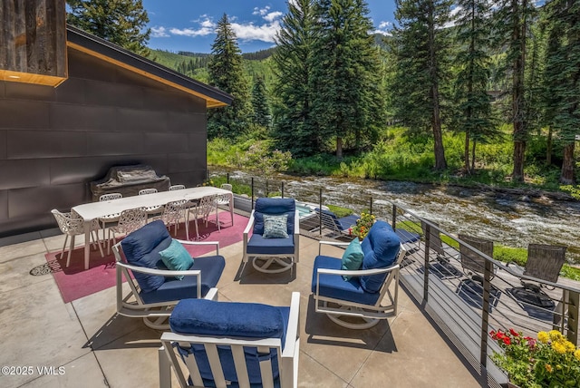 2764 S Frontage Rd, Vail, CO 81657 - view of patio / terrace with a view of trees, outdoor dining space, and a grill