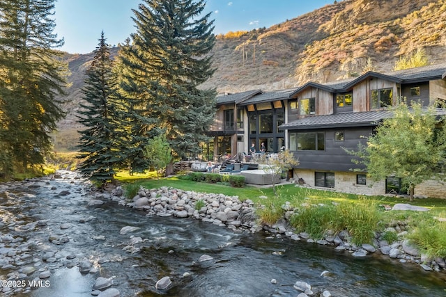 2764 S Frontage Rd, Vail, CO 81657 - back of property featuring a mountain view and a patio area