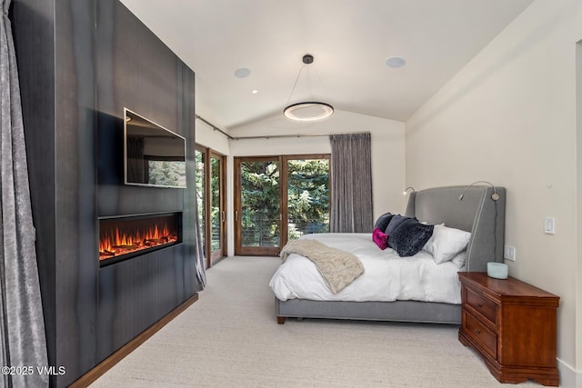 2764 S Frontage Rd, Vail, CO 81657 - bedroom featuring lofted ceiling, light carpet, and a fireplace