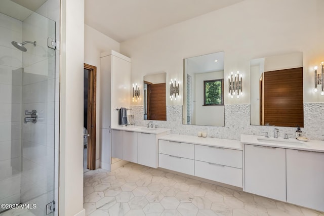 2764 S Frontage Rd, Vail, CO 81657 - bathroom featuring vanity, a stall shower, decorative backsplash, and tile patterned flooring