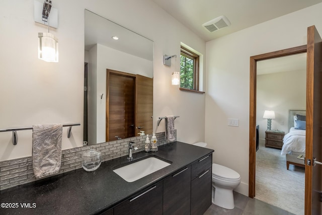 2764 S Frontage Rd, Vail, CO 81657 - bathroom with vanity, connected bathroom, and decorative backsplash