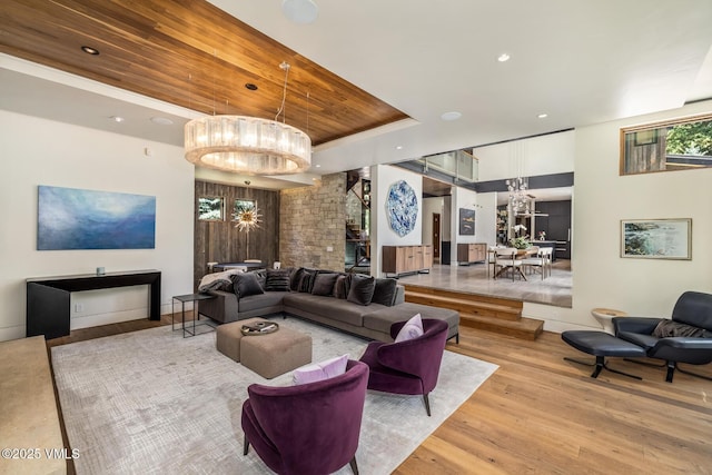 2764 S Frontage Rd, Vail, CO 81657 - living area featuring a chandelier, light wood finished floors, recessed lighting, and a raised ceiling