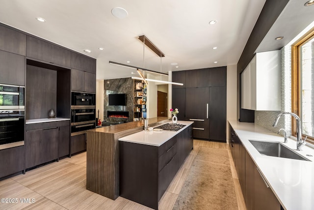 2764 S Frontage Rd, Vail, CO 81657 - kitchen featuring modern cabinets, light countertops, stainless steel gas cooktop, plenty of natural light, and recessed lighting