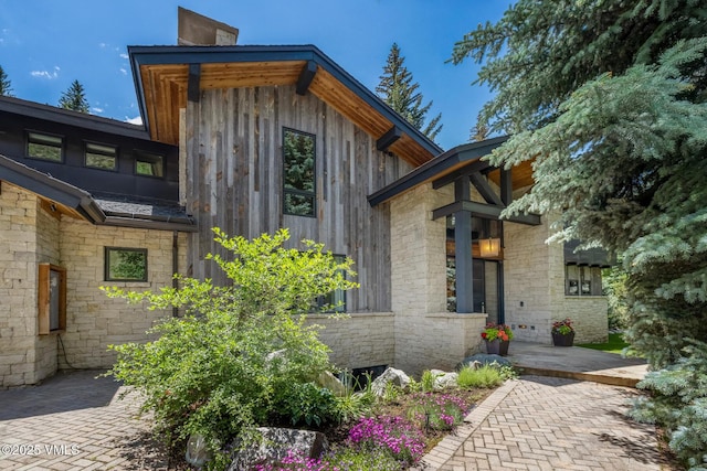 2764 S Frontage Rd, Vail, CO 81657 - view of side of home featuring stone siding