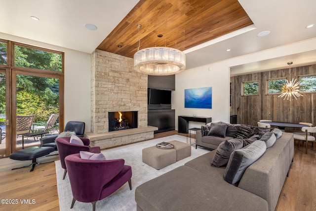 2764 S Frontage Rd, Vail, CO 81657 - living area featuring wood finished floors, plenty of natural light, a fireplace, wood ceiling, and recessed lighting