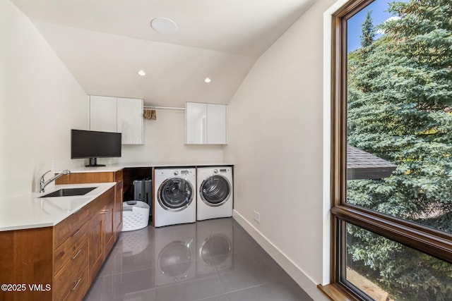 2764 S Frontage Rd, Vail, CO 81657 - laundry area with washer and clothes dryer, dark tile patterned flooring, cabinet space, and recessed lighting
