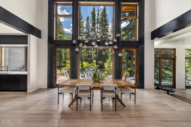 2764 S Frontage Rd, Vail, CO 81657 - dining area featuring a towering ceiling