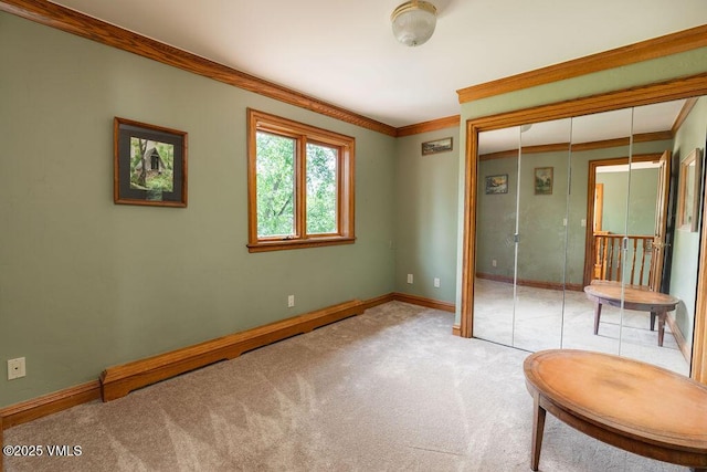 336 E Fourth St, Eagle, CO 81631 - unfurnished bedroom featuring carpet, crown molding, and a closet