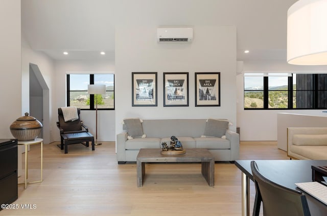 1092 Fourth Of July Rd, Eagle, CO 81631 - living area featuring a wall unit AC, plenty of natural light, light wood-style floors, and recessed lighting
