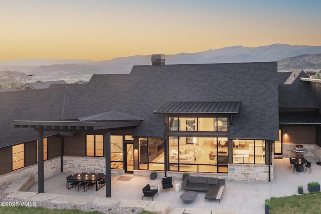 1092 Fourth Of July Rd, Eagle, CO 81631 - rear view of house featuring outdoor lounge area, a patio, and a mountain view