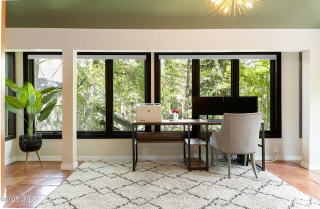 26 Lark Ct Unit B, Eagle-Vail, CO 81620 - tiled dining area with healthy amount of natural light, baseboards, decorative columns, and a desk