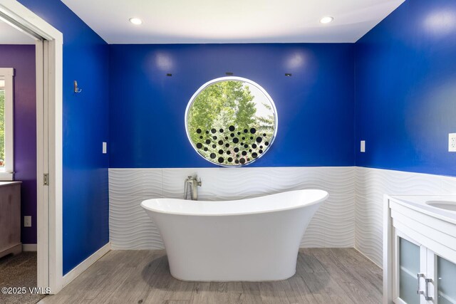 26 Lark Ct Unit B, Eagle-Vail, CO 81620 - bathroom featuring vanity, a freestanding tub, healthy amount of natural light, and recessed lighting